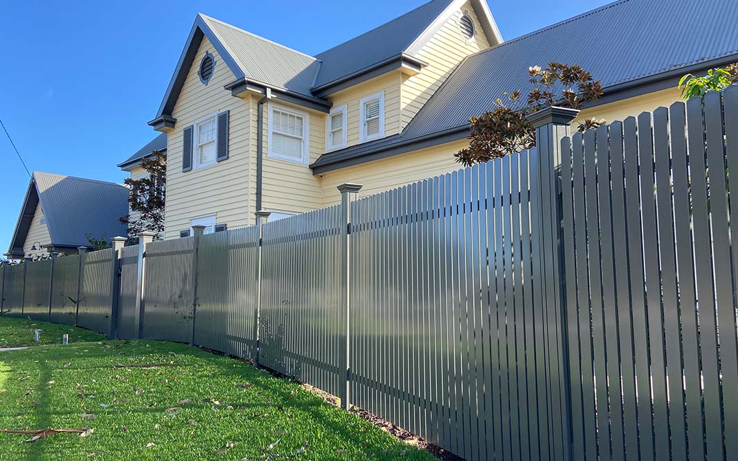 Front view of a house with aluminium fence
