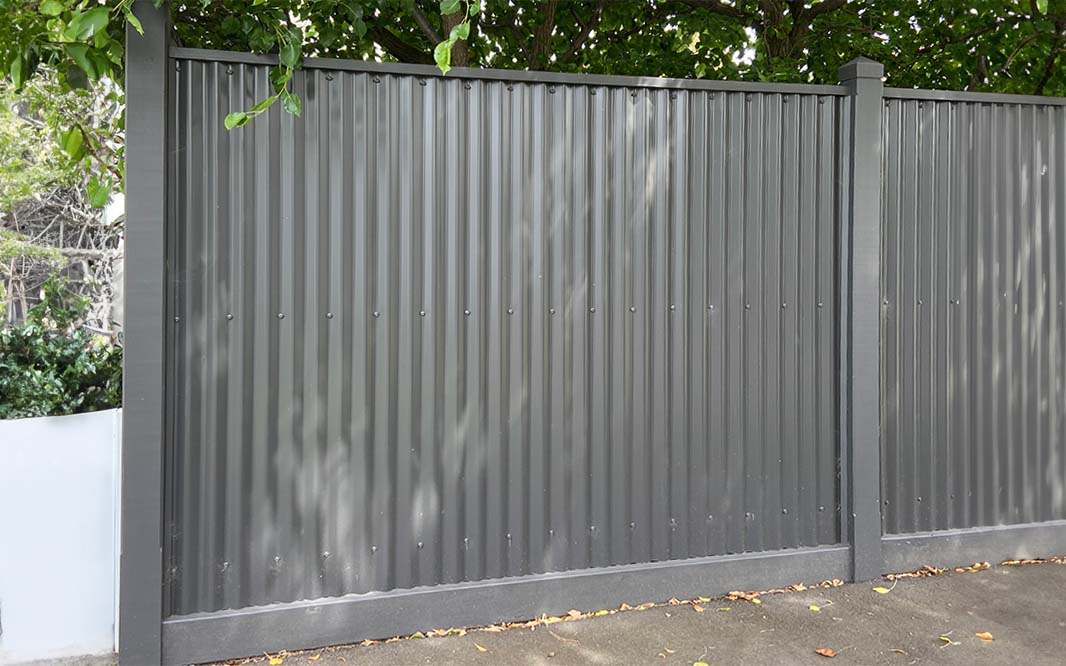 Metal panel beside Colorbond fence