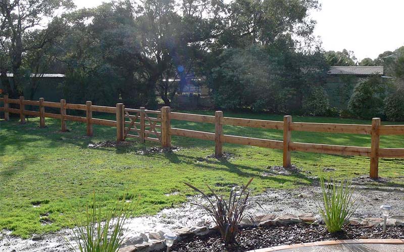 Wooden post and rail fencing in the yard