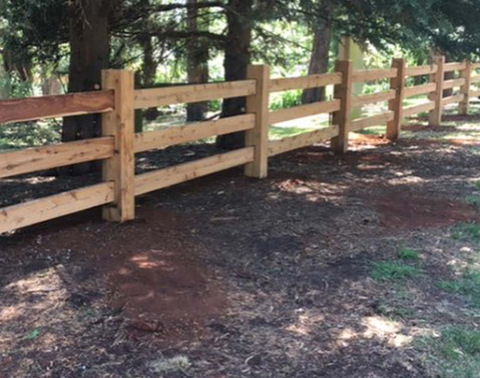 Wooden post and rail fencing in the yard