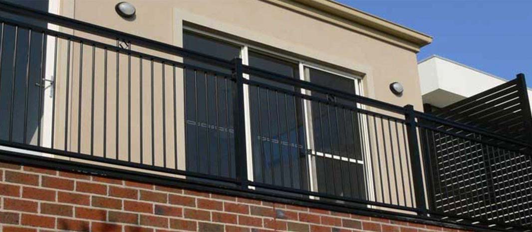 A black metal fence with a window on the side, showcasing an Aluminium Front Fence